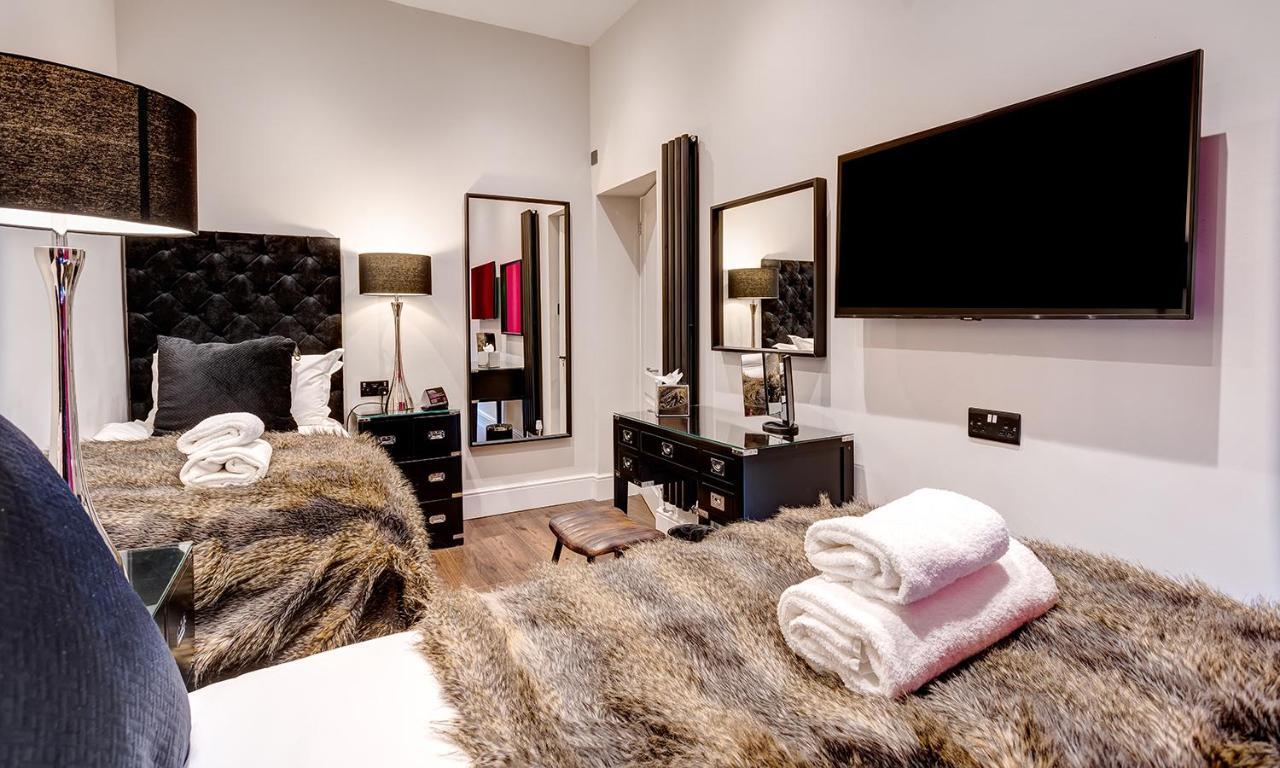 Kotel Windermere Exterior photo A bedroom at The Ivy Collection